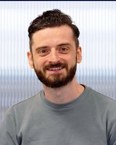 A headshot of Jez Fischer